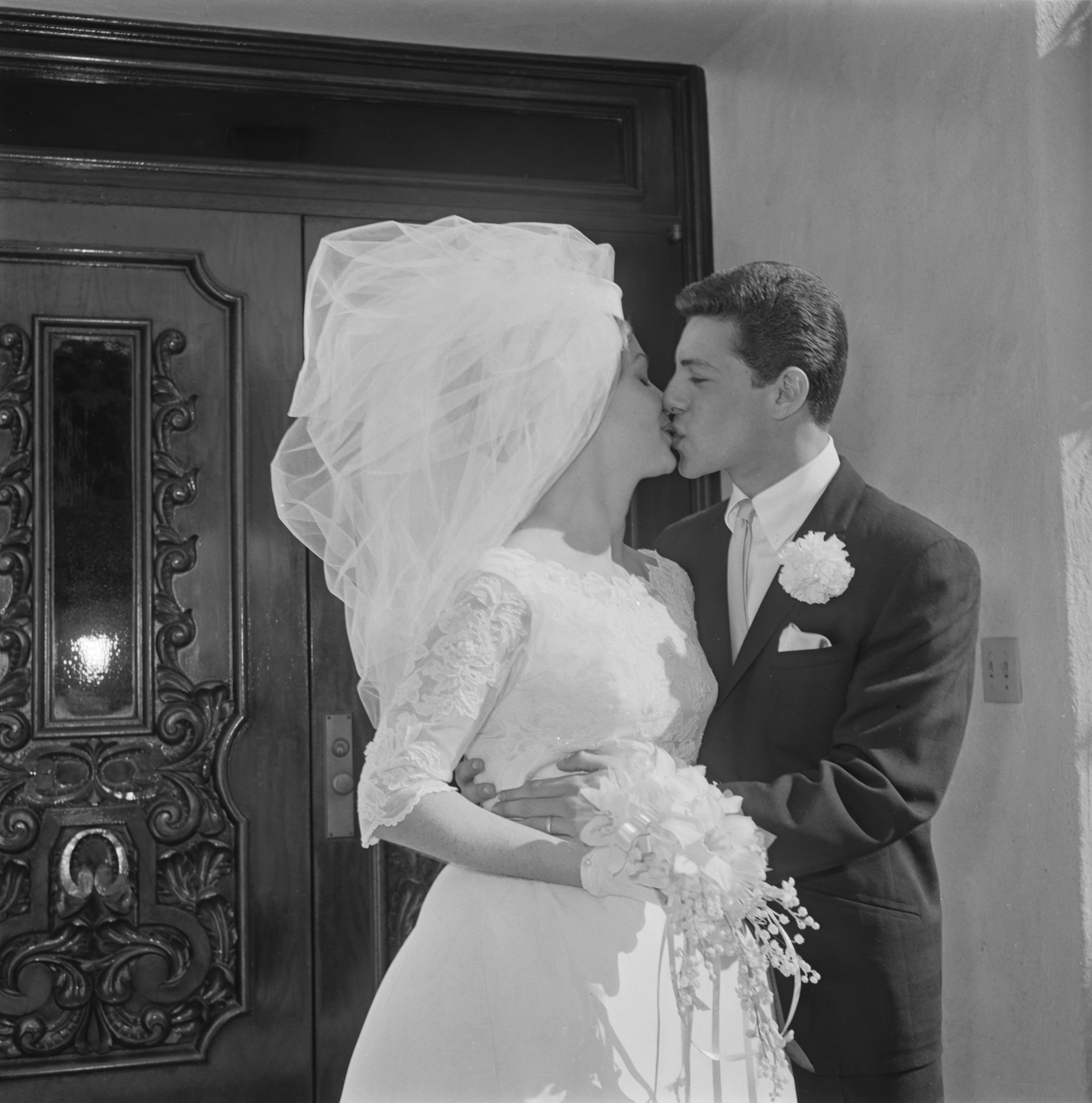 American actor and singer Frankie Avalon with his bride Kathryn 'Kay' Diebel after their wedding in North Hollywood, California on January 19, 1963. | Source: Getty Images