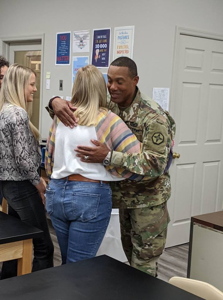 Brigadier General Buggs gives one of his pen pals a hug during their first meeting after thirteen years of letter exchanges. | Source: Facebook/davidemmanuelacademy