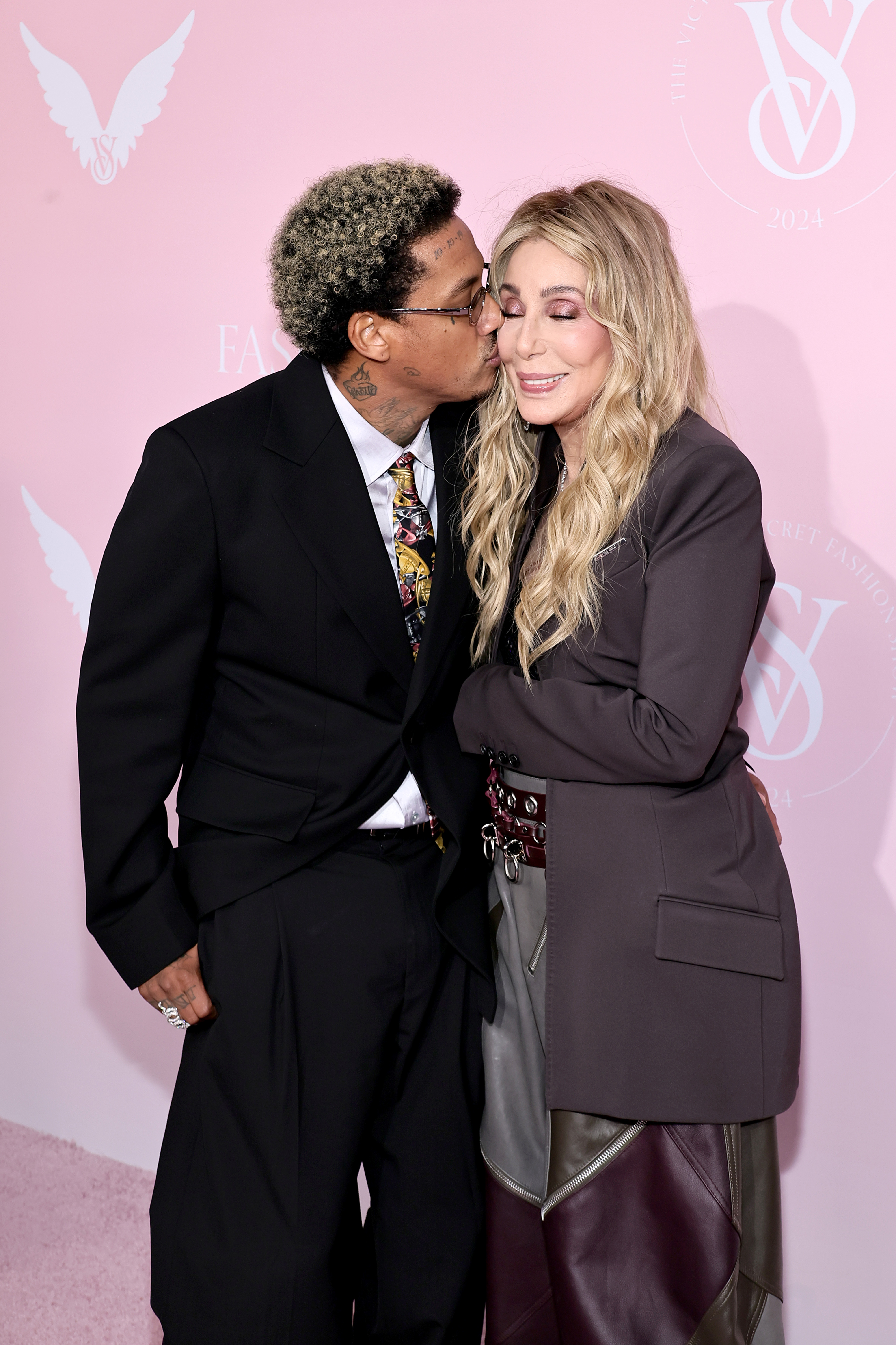 Alexander "AE" Edwards and Cher attend the Victoria's Secret Fashion Show at Duggal Greenhouse in Brooklyn, New York on October 15, 2024 | Source: Getty Images