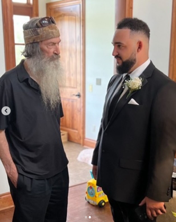 Phil Robertson stands with his grandson Will Robertson during a family gathering, as shared in a photo on social media | Source: Instagram/willr0b