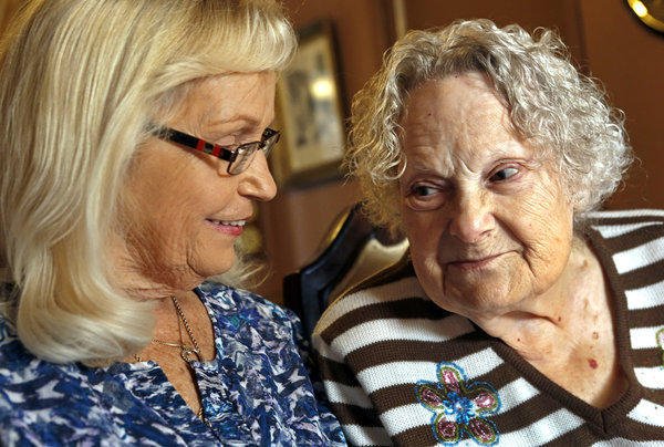 Patricia Hamlin, 71, left, and her mother Brooke Mayo, 90, are photographed at Mayo's home in Paso Robles on December 18, 2013 | Source: Getty Images