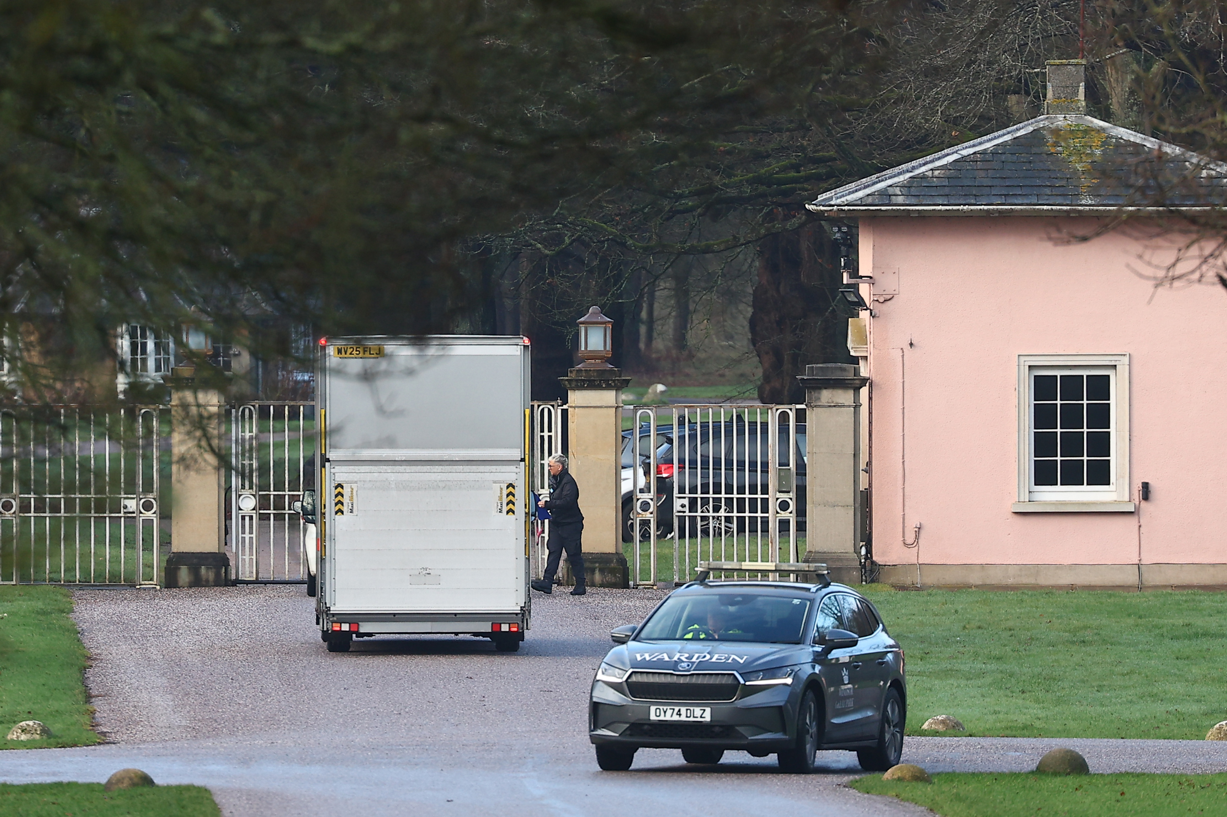 A removals lorry is seen at the gated entrance of Royal Lodge in Windsor Great Park as the former home of Andrew Mountbatten-Windsor begins to be cleared following his departure. The arrival of the van underscored the finality of his exit from the sprawling estate, coming just hours after he left Windsor under the cover of darkness for the Sandringham Estate on February 4, 2026.