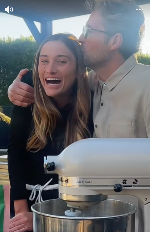 Patrick kisses his daughter Talula Dempsey on the side of her head while they bake together. | Source: TikTok/talulafyfedempsey