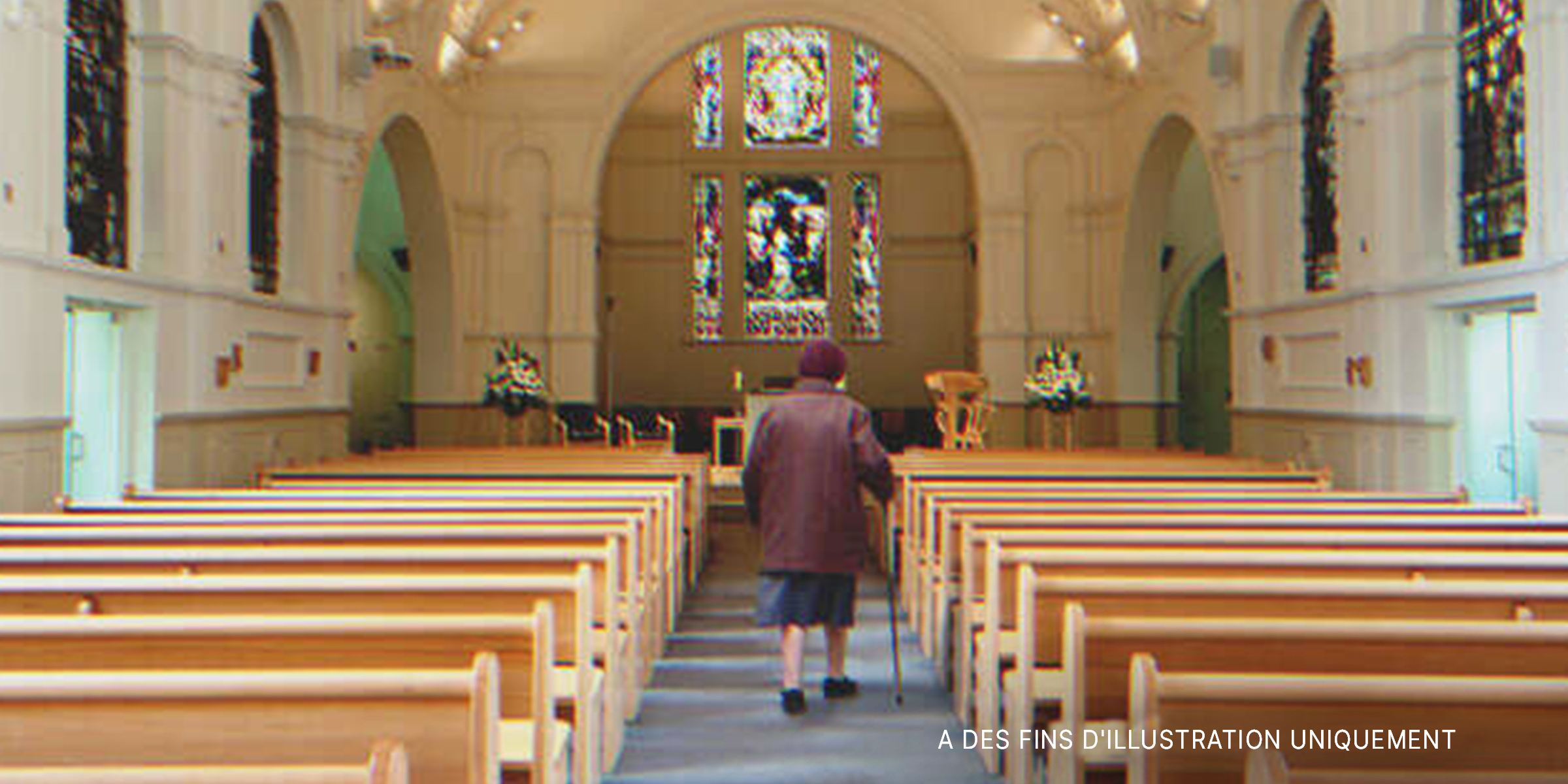 Une femme âgée dans une église | Photo : Getty Images