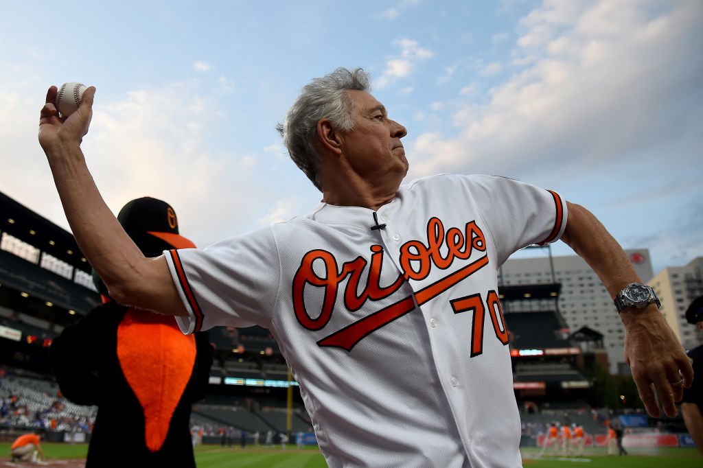 Barry Williams throws the first pitch at an Orioles game. Image Credit: Getty Images