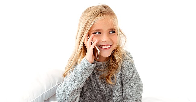 A photo of a young girl on the phone. | Photo: Shutterstock