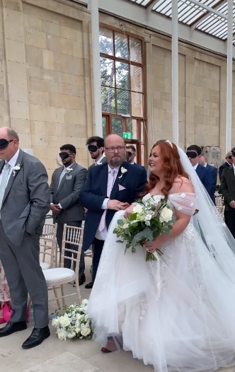Lucy Edwards walking down the aisle with her father in her TikTok video dated September 10, 2023 | Source: tiktok.com/lucyedwards