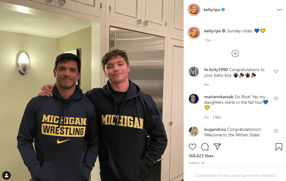 Mark Consuelos and his son pose in University of Michigan hoodies. | Photo: Instagram/kellyripa