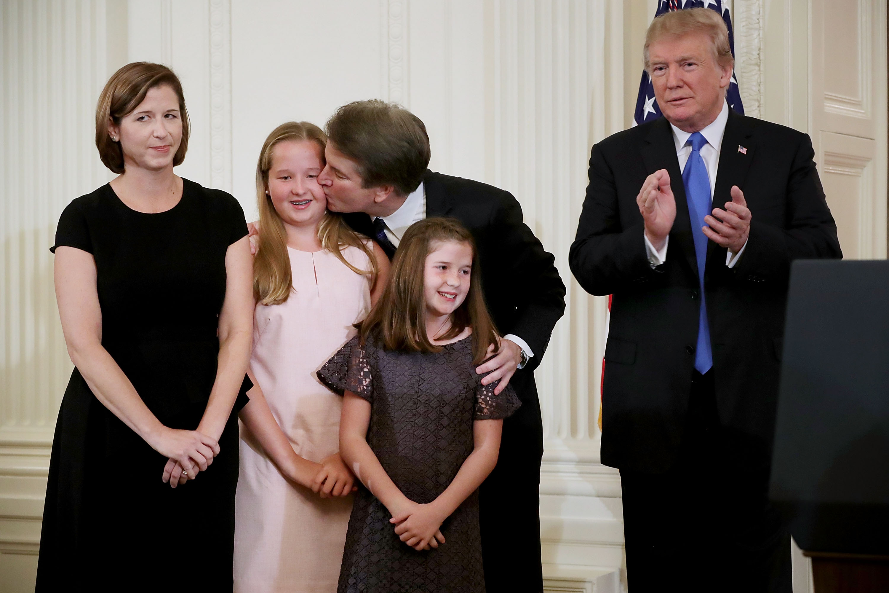 Ashley and Judge Brett Kavanaugh with their children and Donald Trump in the East Room of the White House July 9, 2018, in Washington, D.C. | Source: Getty Images