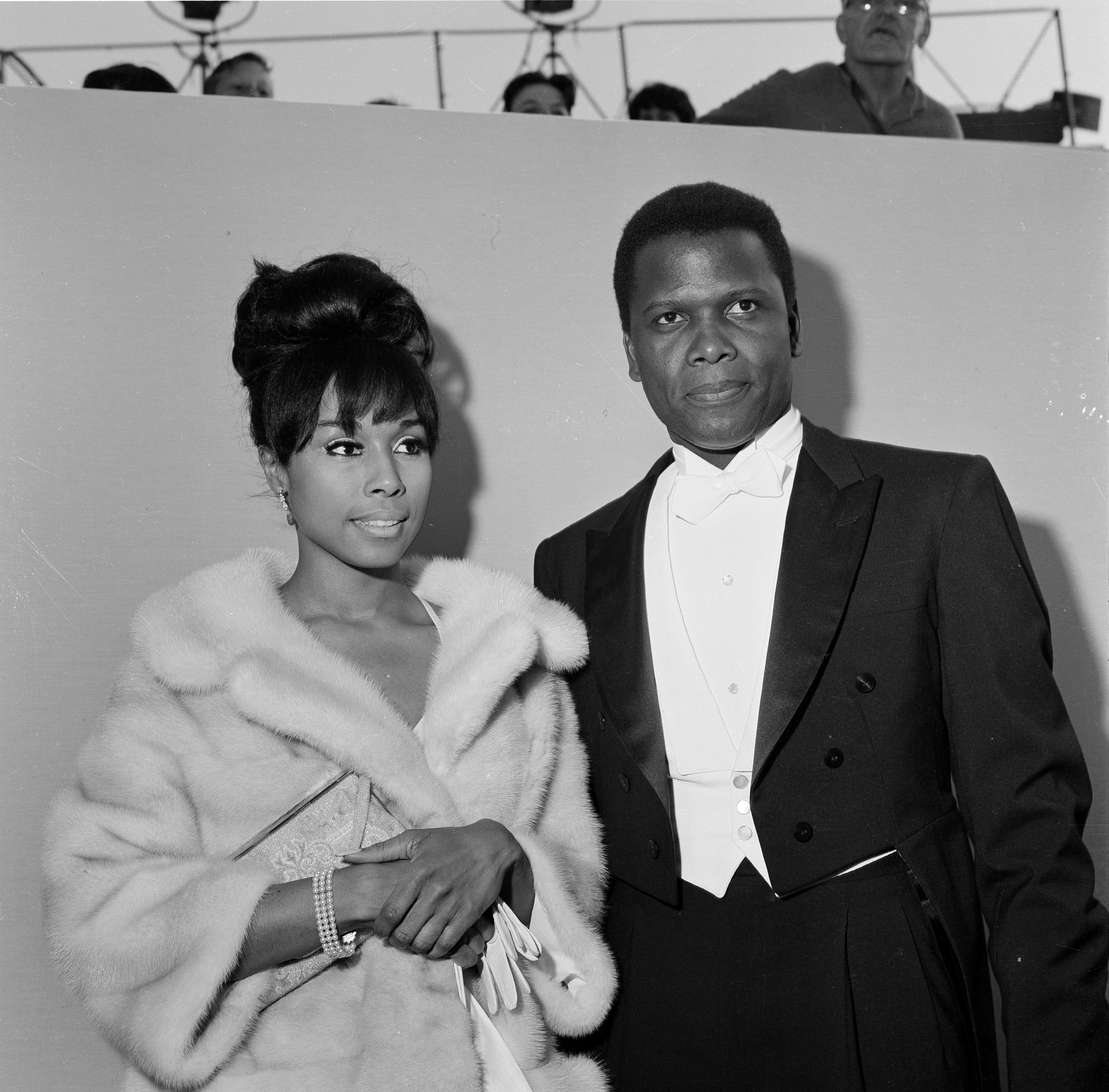 Sidney Poitier and Diahann Carroll during The 36th Academy Awards in Santa Monica,CA. | Source: Getty Images