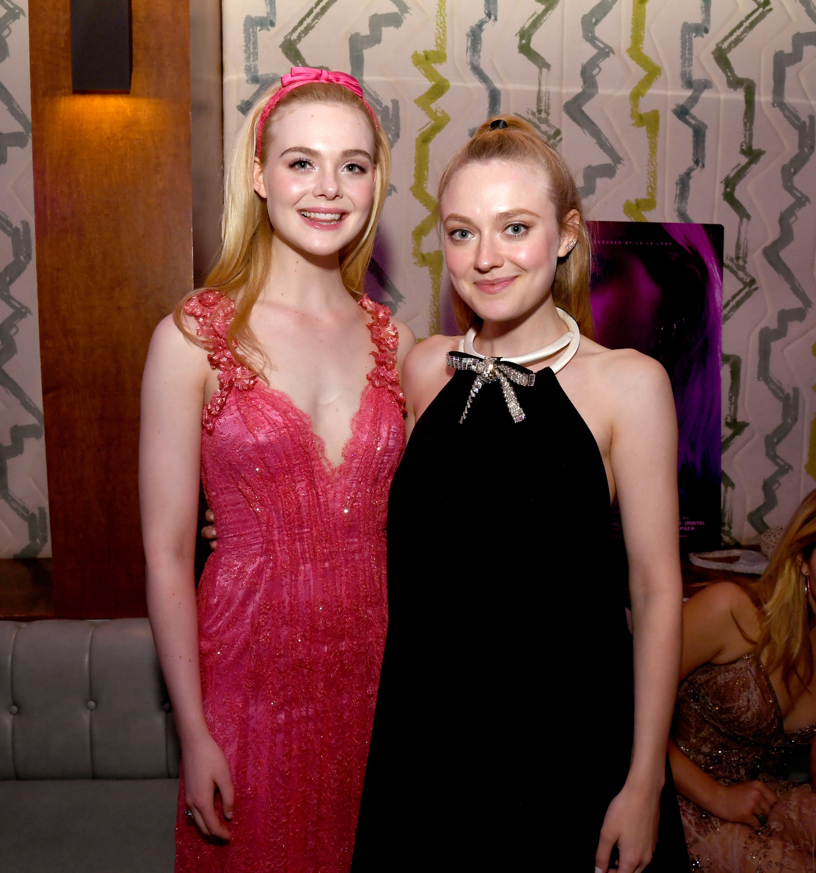 Elle Fanning and Dakota Fanning pose at the after party for a special screening of Bleeker Street's "Teen Spirit" at the Highlight Room on April 02, 2019 in Hollywood, California | Photo: Getty Images
