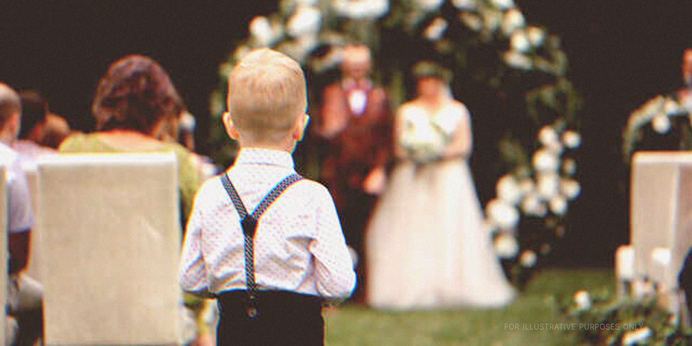 A young boy walking down the aisle | Source: Shutterstock