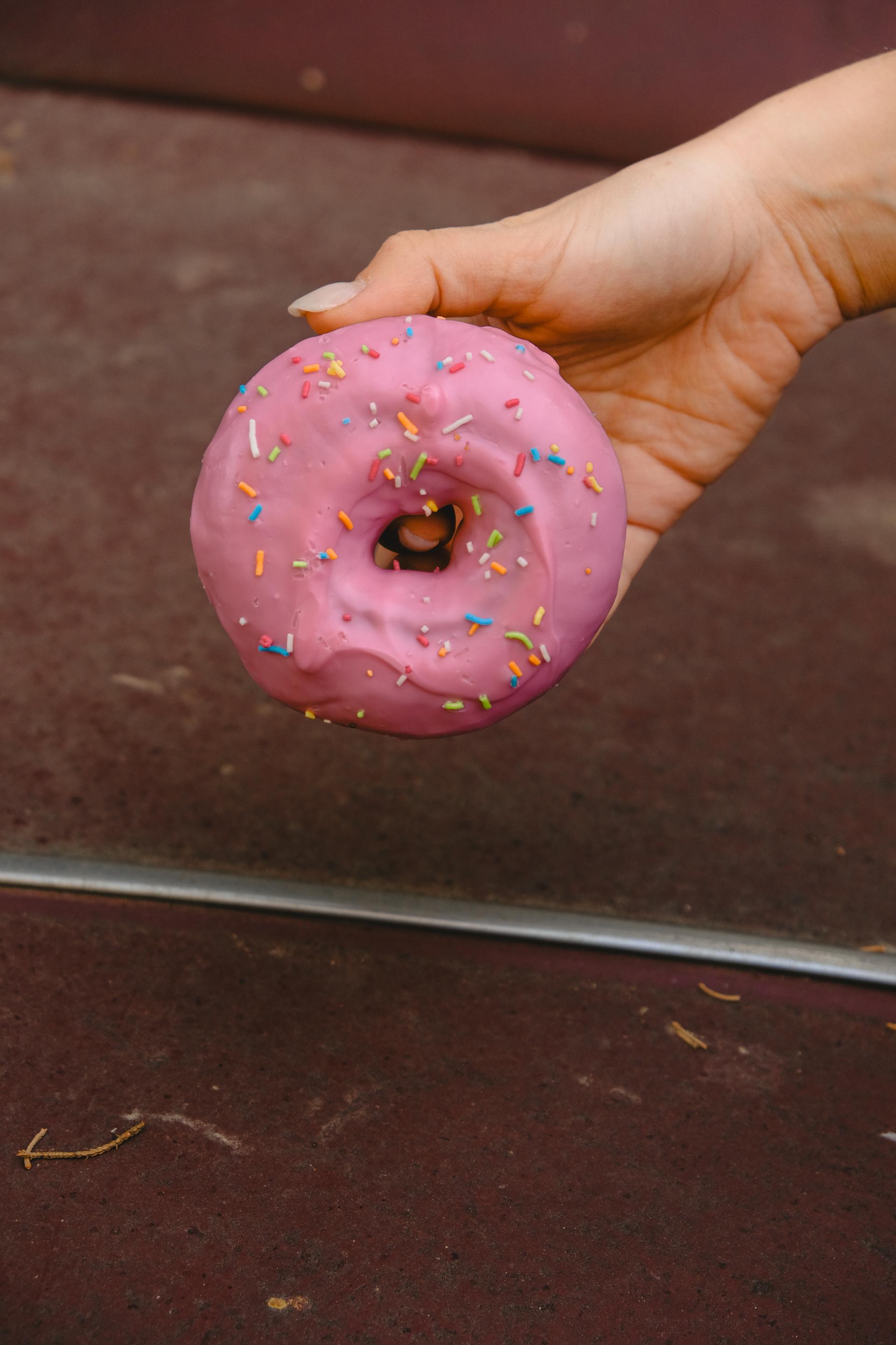 A person holding a donut | Source: Pexels