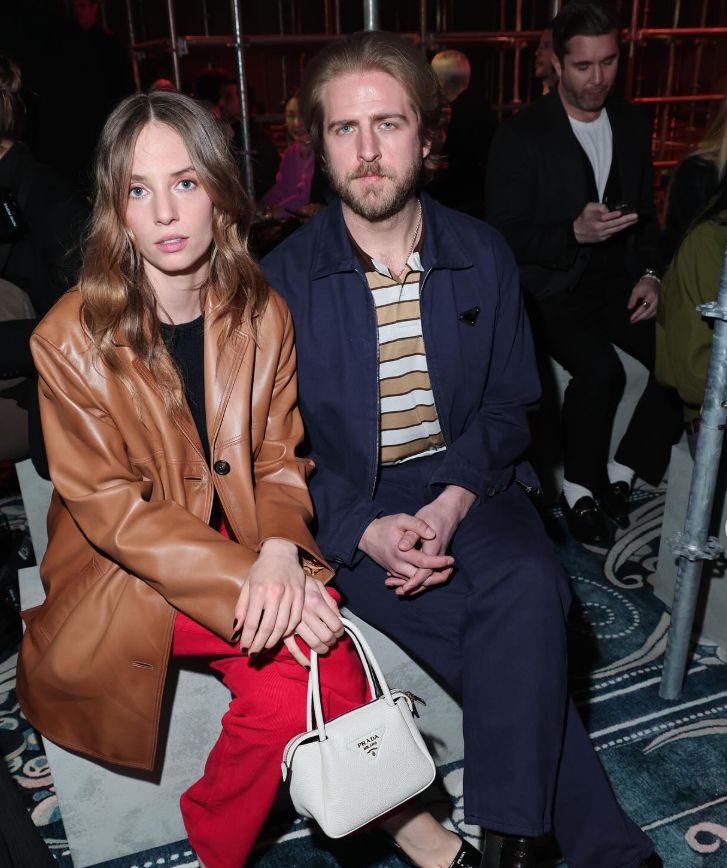 Maya Hawke and Christian Hutson sit front row at the fashion show, dressed in coordinated, polished looks. | Source: Instagram/maya_hawke