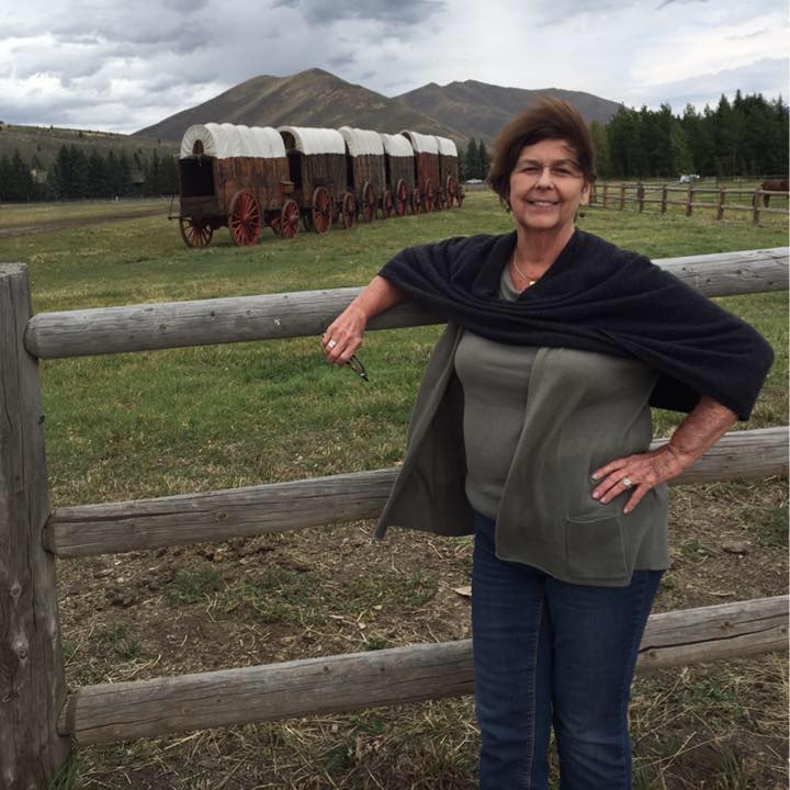 Nancy Guthrie rests one arm on a fence and another on her waist, from a post dated September 4, 2015. | Source: Facebook/NancyGuthrie