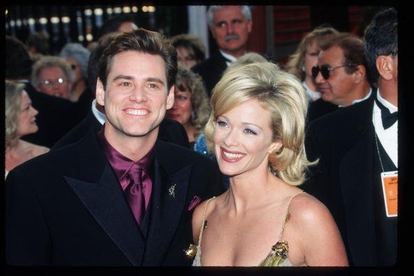 Jim Carrey and Lauren Holly at the 69th Annual Academy Awards ceremony March 24, 1997 in Los Angeles, CA. | Photo: Getty Images