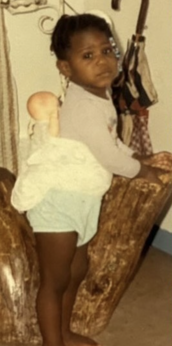 The actress balancing on a chair as a playful toddler at home | Source: Instagram/gabbysidibe