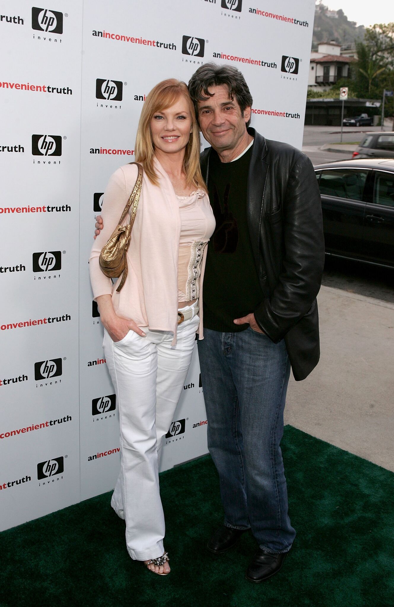 Marg Helgenberger (L) and husband SAG President Alan Rosenberg arrive at the Los Angeles Premiere Of "An Inconvenient Truth" held at the DGA  | Getty Images