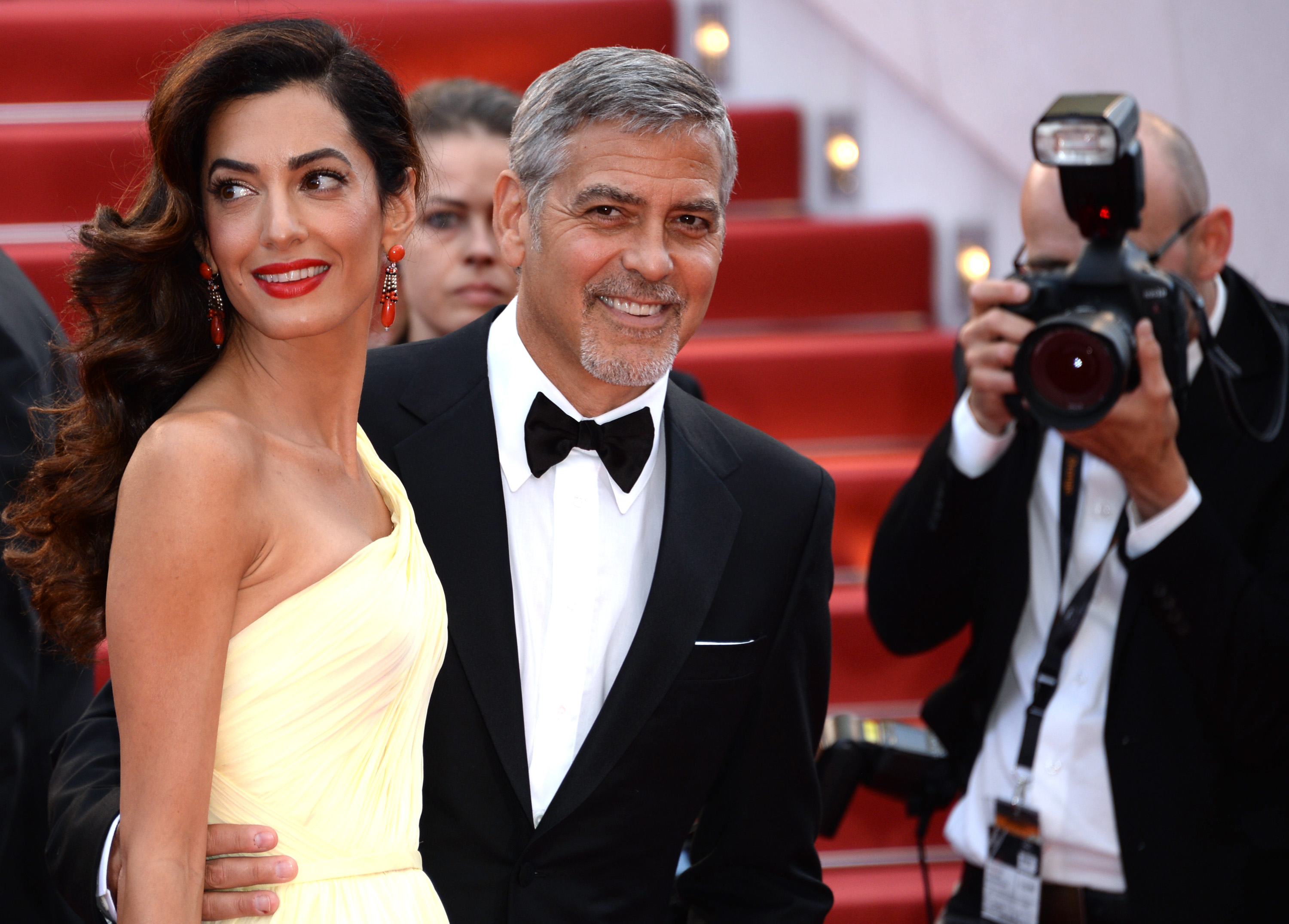 George Clooney and his wife Amal Clooney attending the "Money Monster" premiere at the Palais des Festivals on May 12, 2016, in Cannes, France | Source: Getty Images