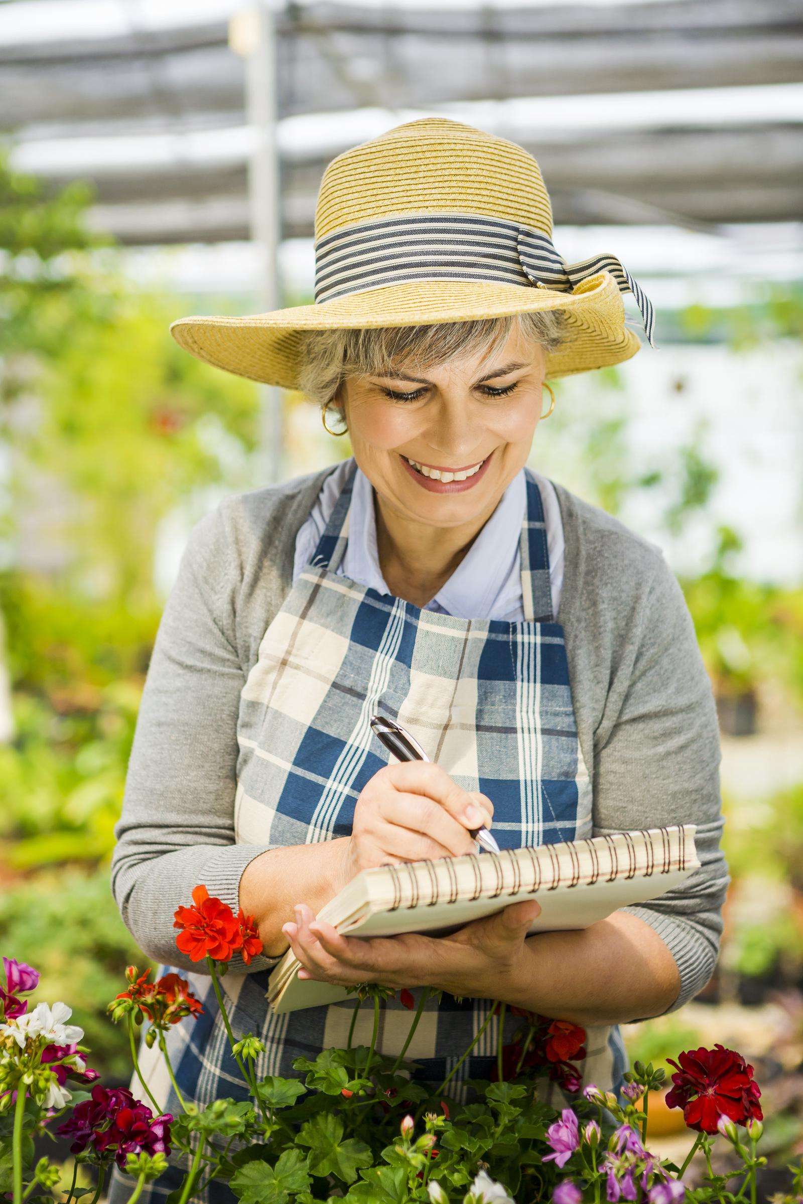 Woman writing reflections on a journal | Source: Shutterstock