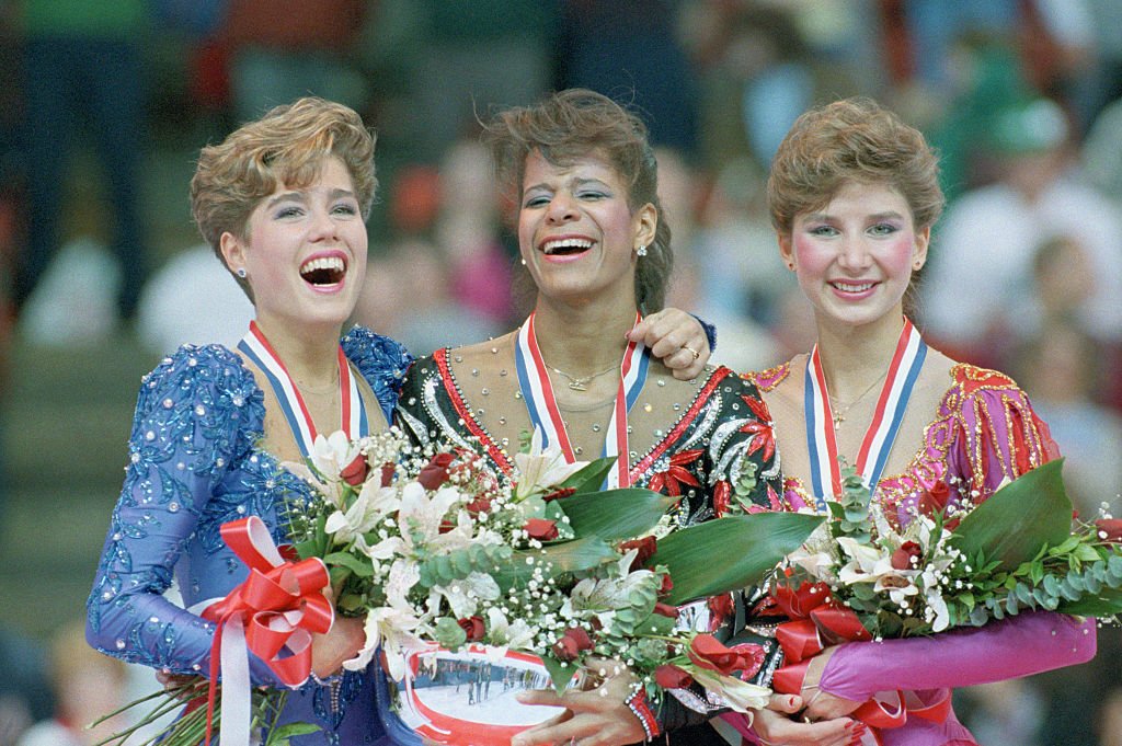 Jill Trenary, Debi Thomas and Caryn Kadavy fter capturing medals at the U.S. Figure Skating Championships in Denver, 1988 | Photo: GettyImages