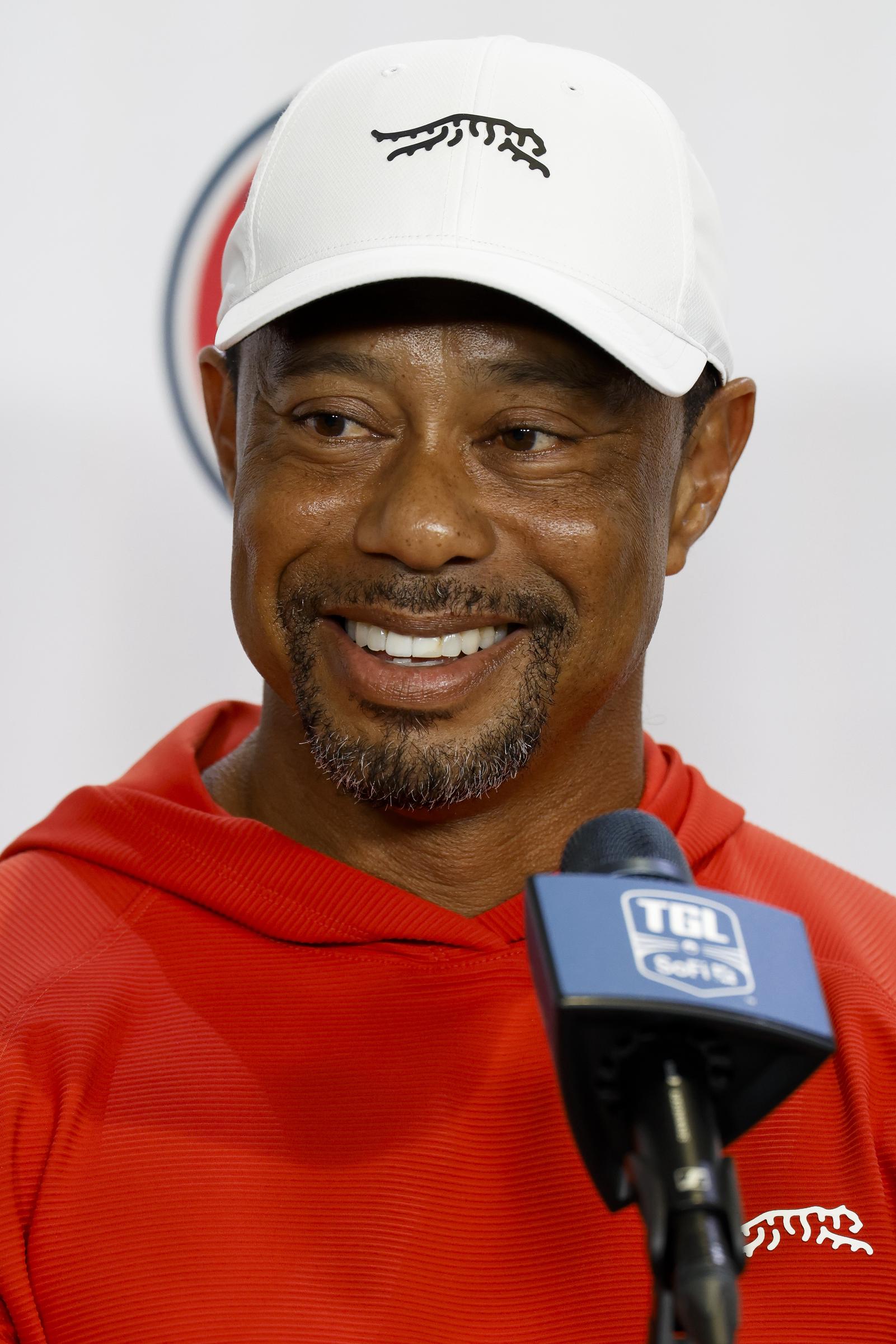 Tiger Woods speaking with the press after a match against Boston Common Golf in Palm Beach Gardens, Florida on March 17, 2026. | Source: Getty Images