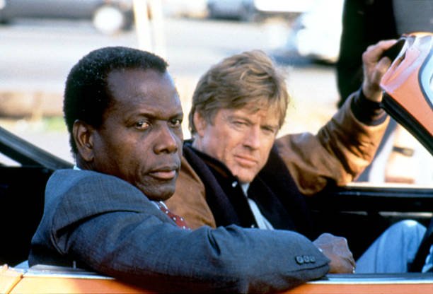  Sidney Poitier and Robert Redford on the set of "Sneakers" written and directed by Phil Alden Robinson. | Photo: Getty Images