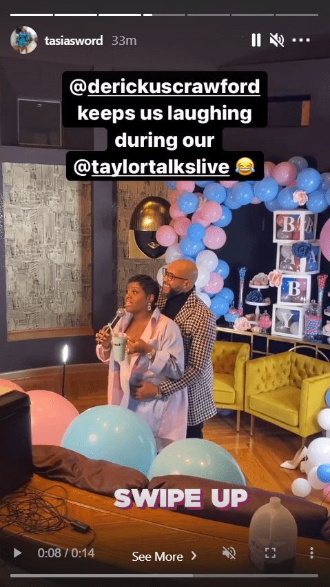 A screenshot from a video of singer Fantasia Barrino and her husband Kendall Taylor on Instagram as he cradles her baby bump | Photo: Instagram/tasiasworld