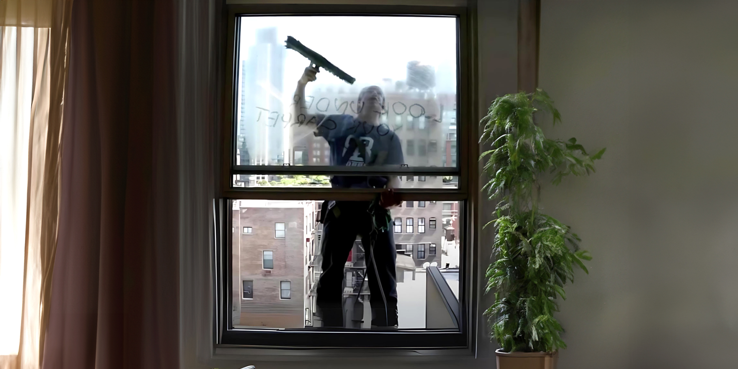 A person cleaning a window | Source: Amomama