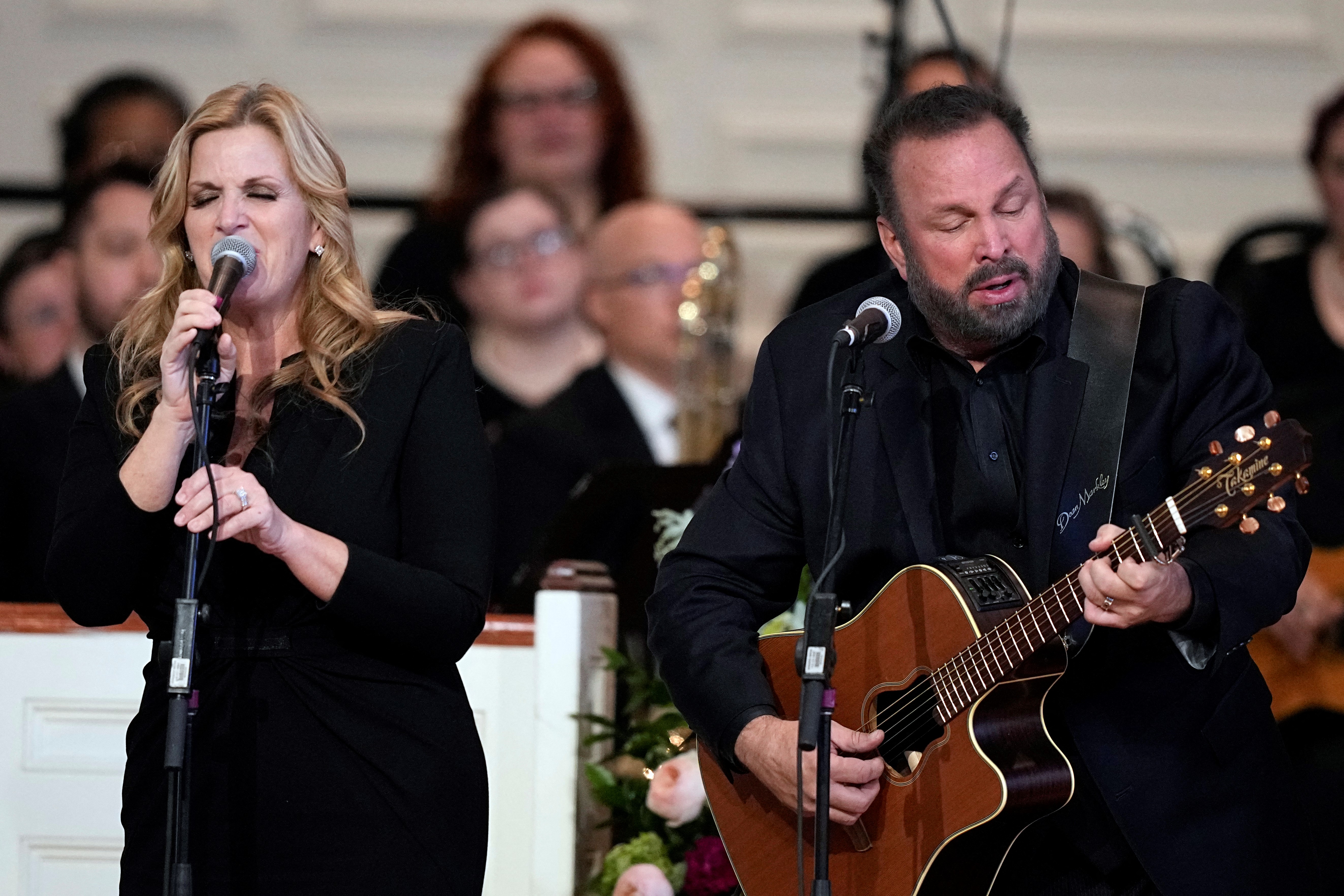 Garth Brooks and Trisha Yearwood perform "Imagine" at a tribute service for former US first lady Rosalynn Carter at Glenn Memorial Church at Emory University in Atlanta, on November 28, 2023 | Source: Getty Images