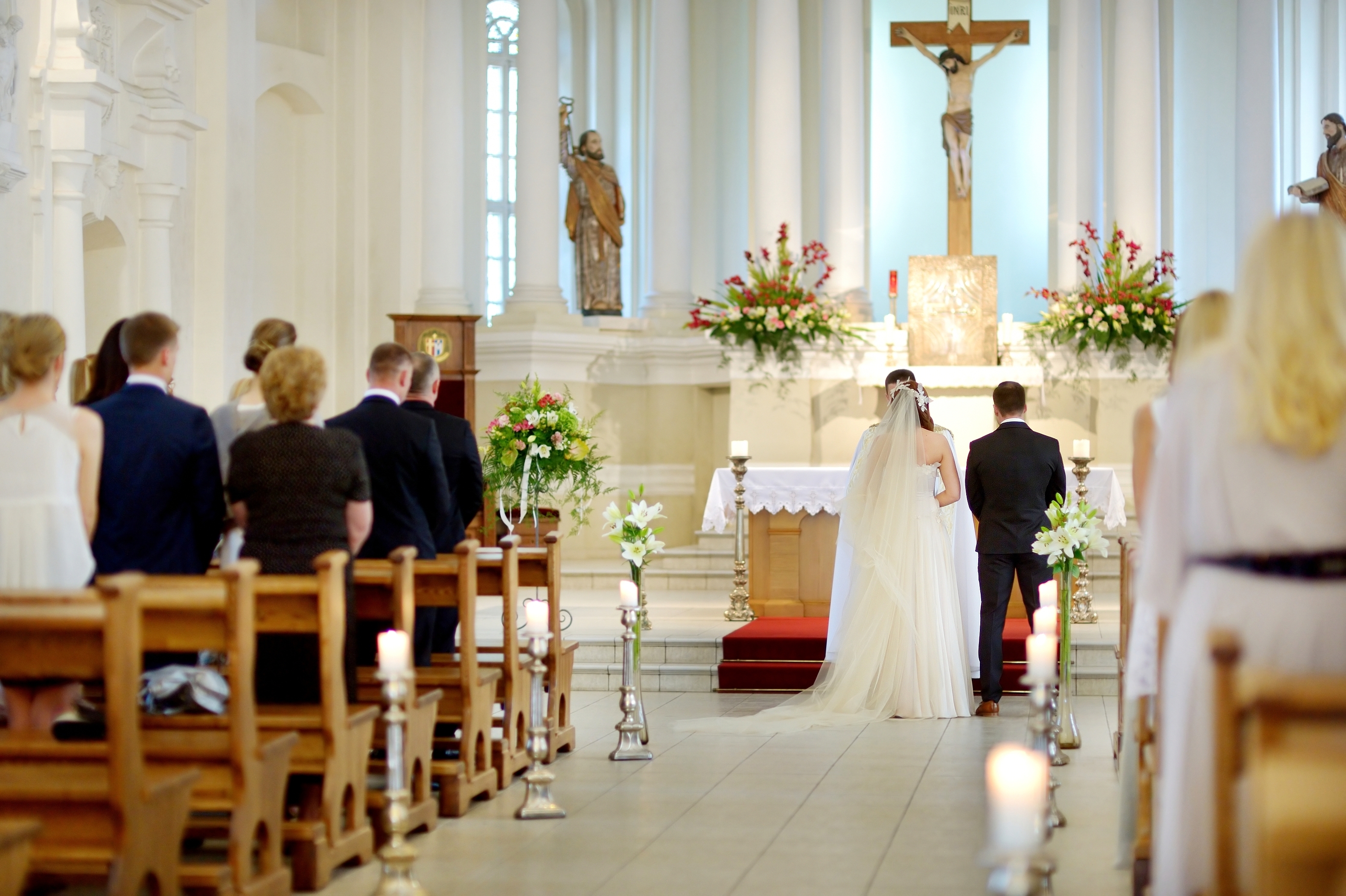 Bride and groom at the church during a wedding ceremony. | Source: Shutterstock