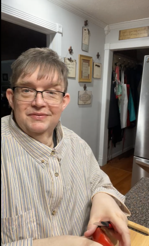 This is how viewers first saw John Davis during the livestream. As he sliced tomatoes at the kitchen table, it looked like another ordinary episode of the cooking show he shared with his mother. | Source: Facebook/coffeetimewithjohnandmomma