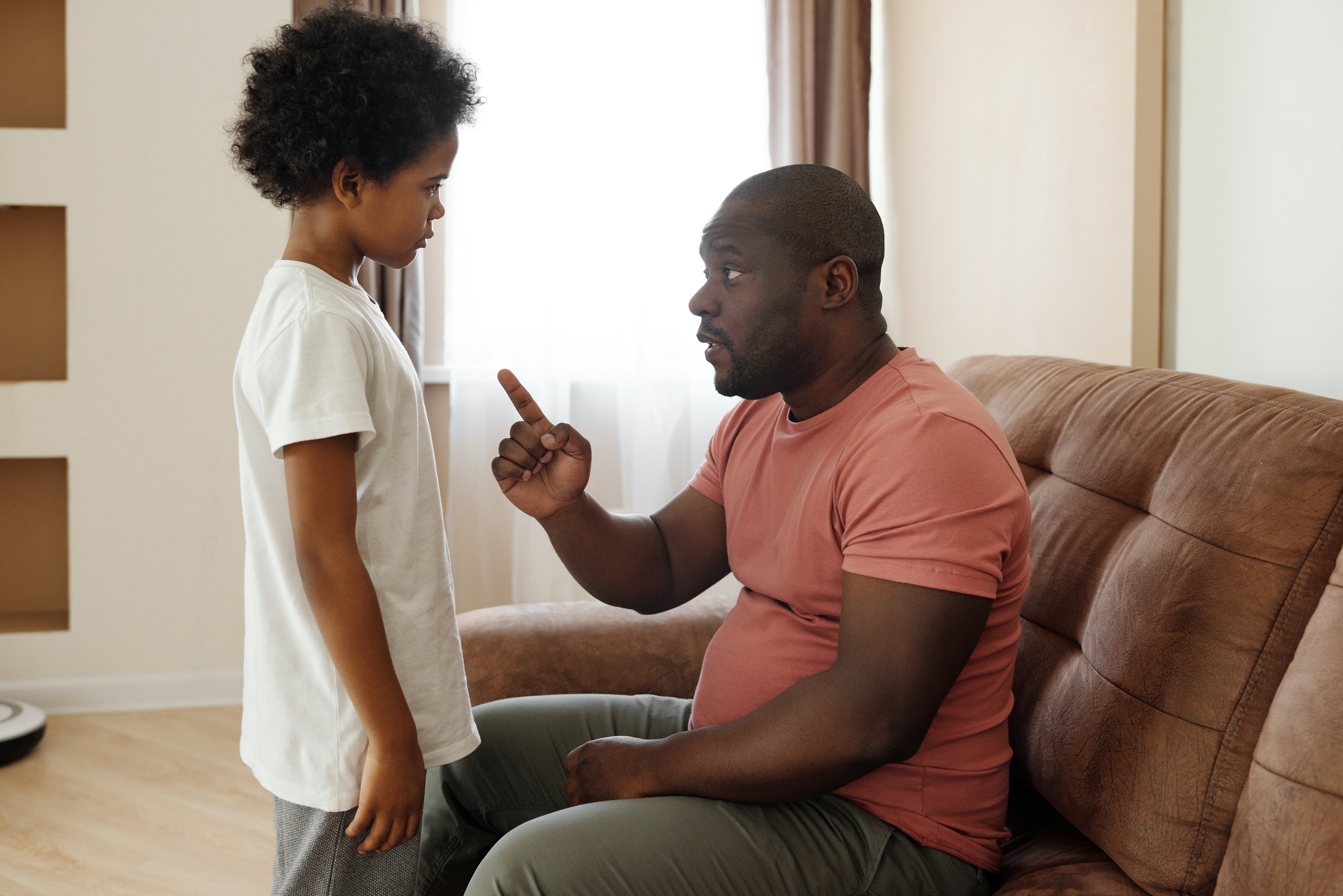 Father scolding his son | Photo: Pexels