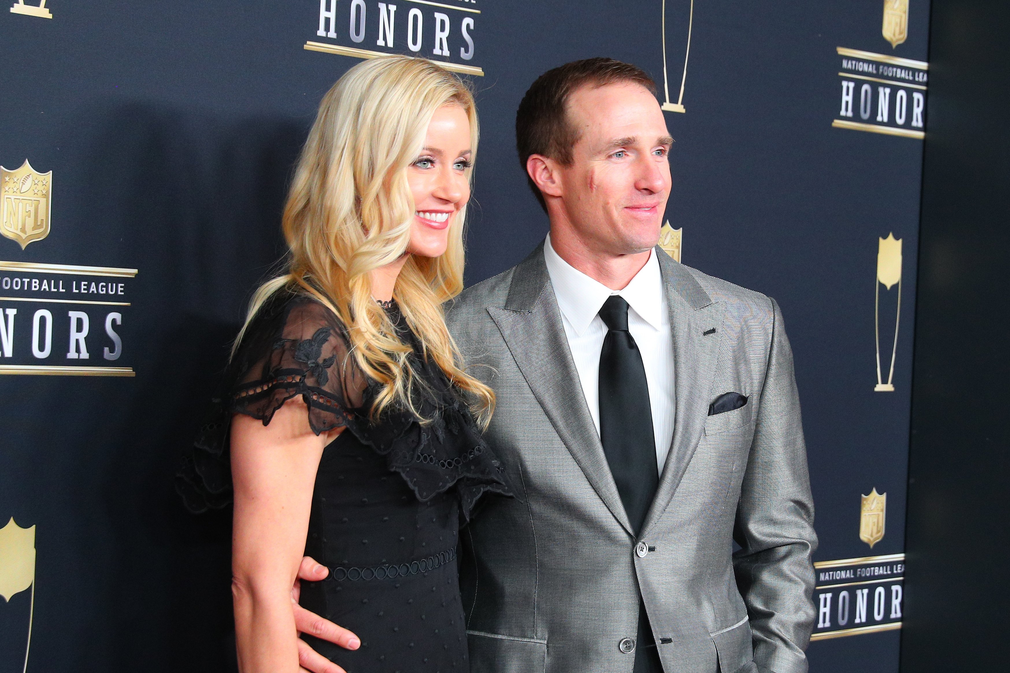 Drew Brees and his wife Brittany pose for photographs on the Red Carpet at NFL Honors during Super Bowl LII week on February 3, 2018, at Northrop at the University of Minnesota in Minneapolis, MN. | Source: Getty Image