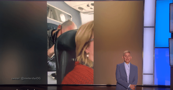 Ellen DeGeneres shows her viewers the video clip of the "punching man" on the American Airlines flight on February 19, 2020. | Source: YouTube/TheEllenShow