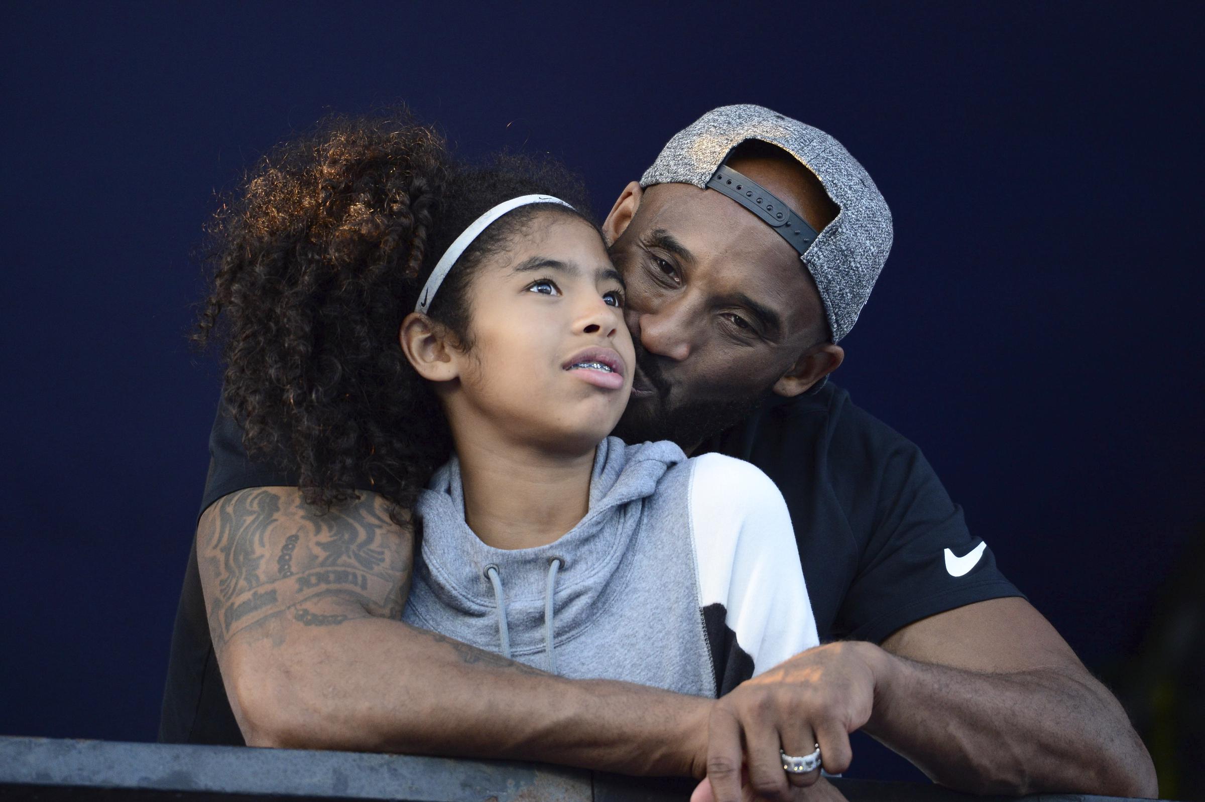 Gianna and Kobe Bryant photographed at the 2018 Phillips 66 U.S. National Swimming Championships on July 26. | Source: Getty Images