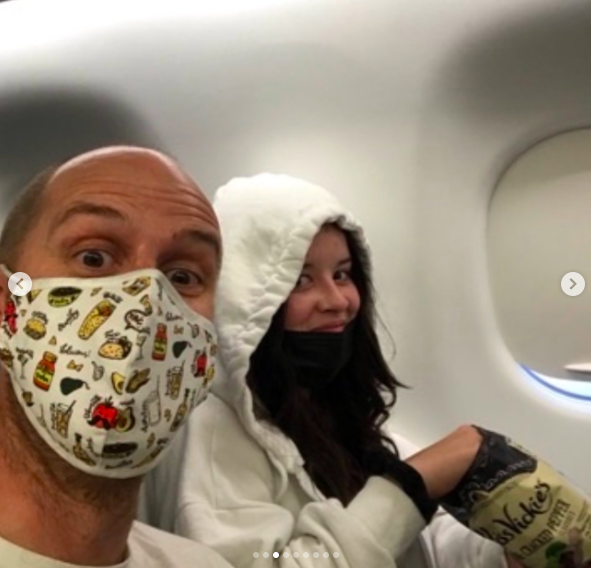 Nell Smith posing for a photo in an airplane with a loved one, posted on October 8, 2024 | Source: Instagram/judesmithjude and nellsmithmusic