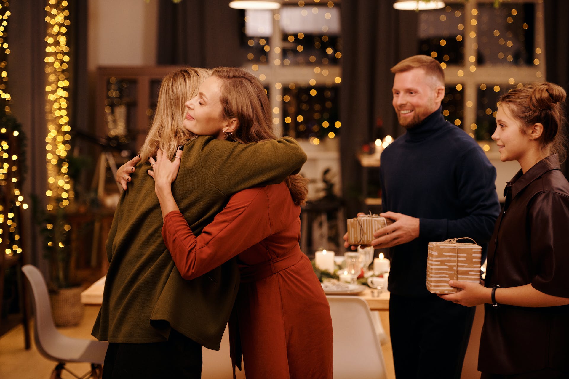 A woman hugging her mother at family dinner | Source: Pexels