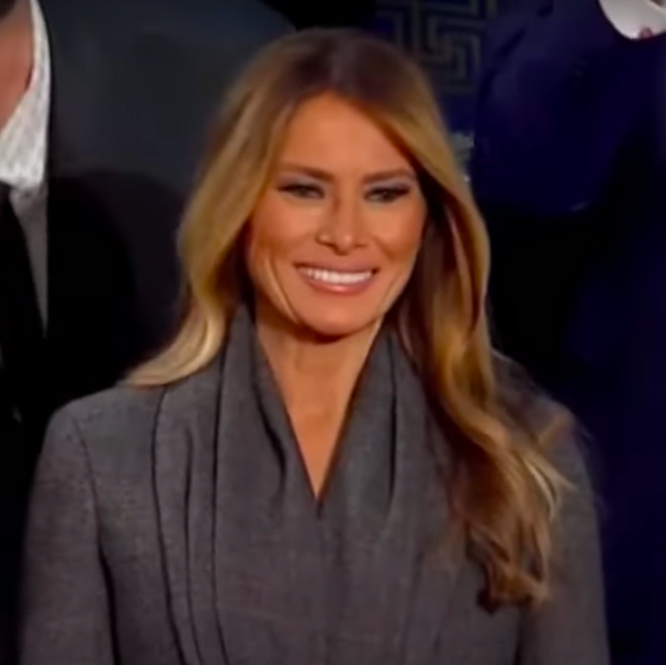 Melanie Trump smiling widely after Donald Trump praised her. | Source: YouTube/Forbes Breaking News