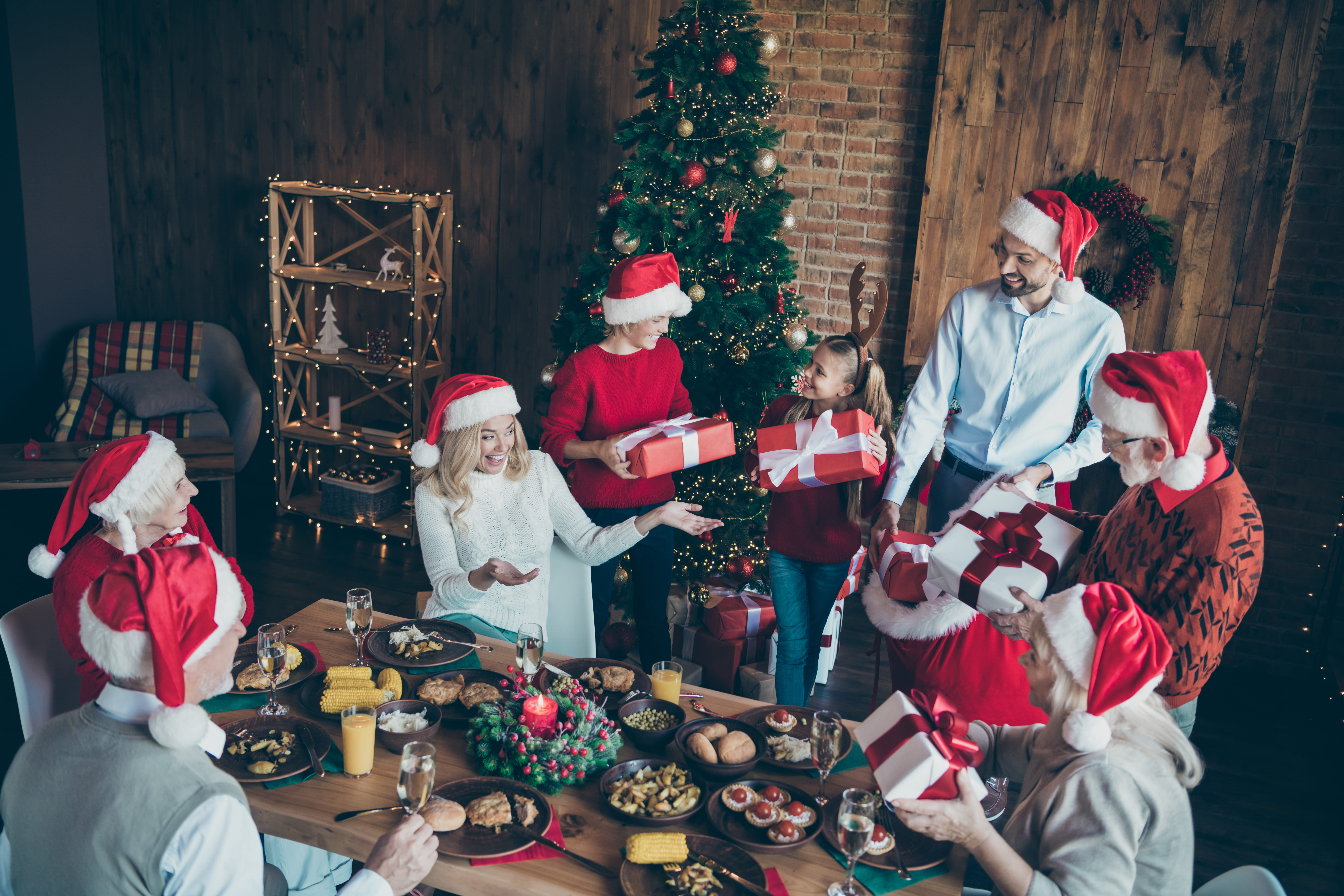 Family members exchanging gifts on Christmas | Source: Shutterstock