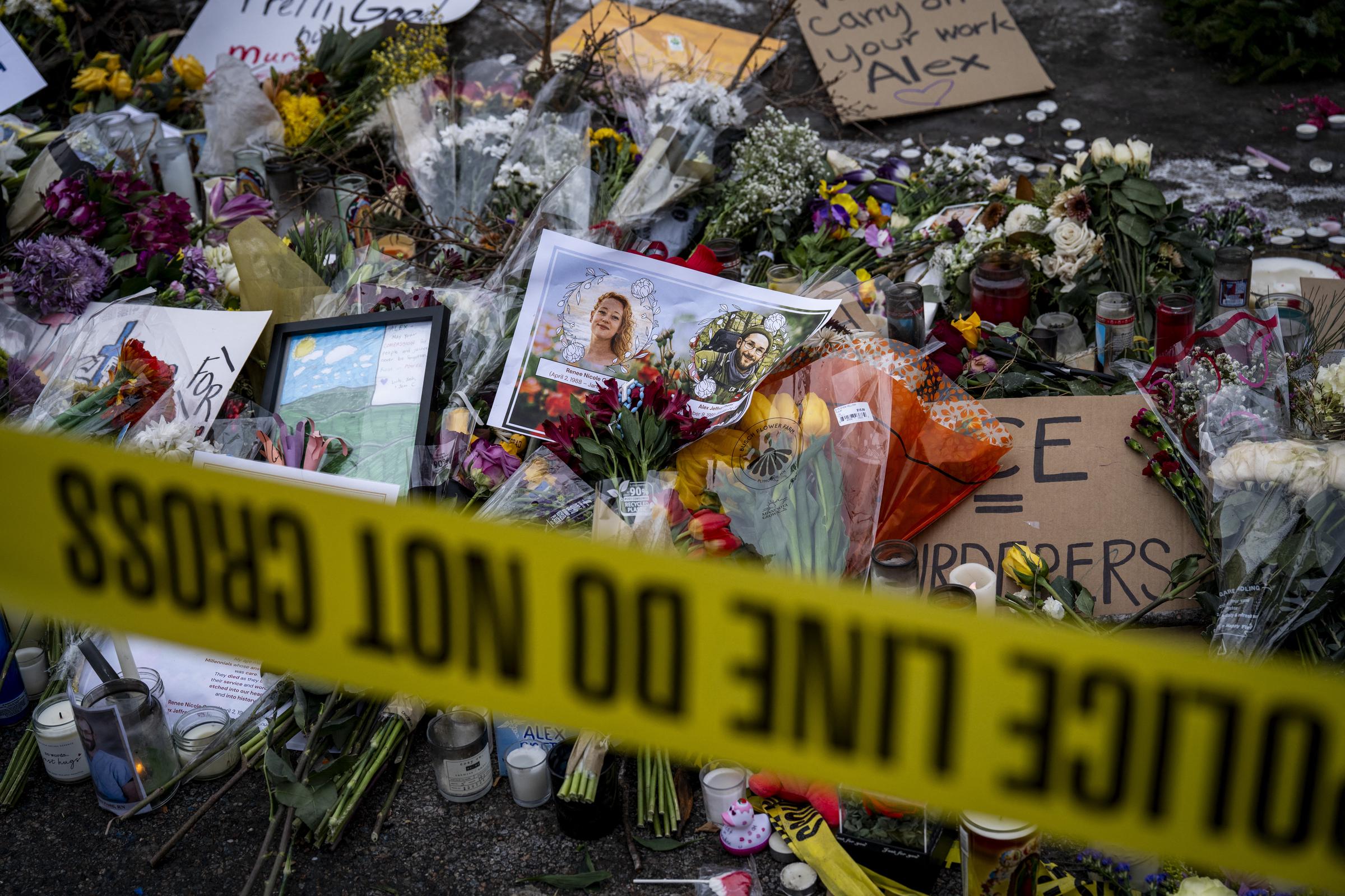 Photos of Renee Good and Alex Pretti are placed at a memorial in Minneapolis on January 26, 2026 | Source: Getty Images
