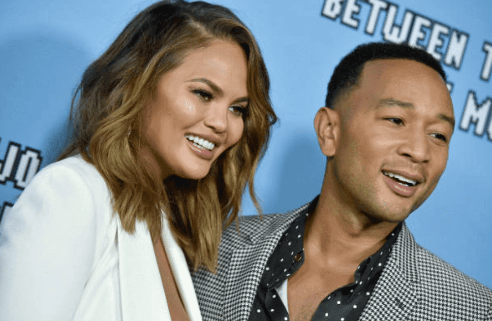 Chrissy Teigen and John Legend pose on the red carpet for the premiere of Netflix's "Between Two Ferns: The Movie," on September 16, 2019, in Hollywood, California | Source: Getty Images (Photo by Axelle/Bauer-Griffin/FilmMagic)