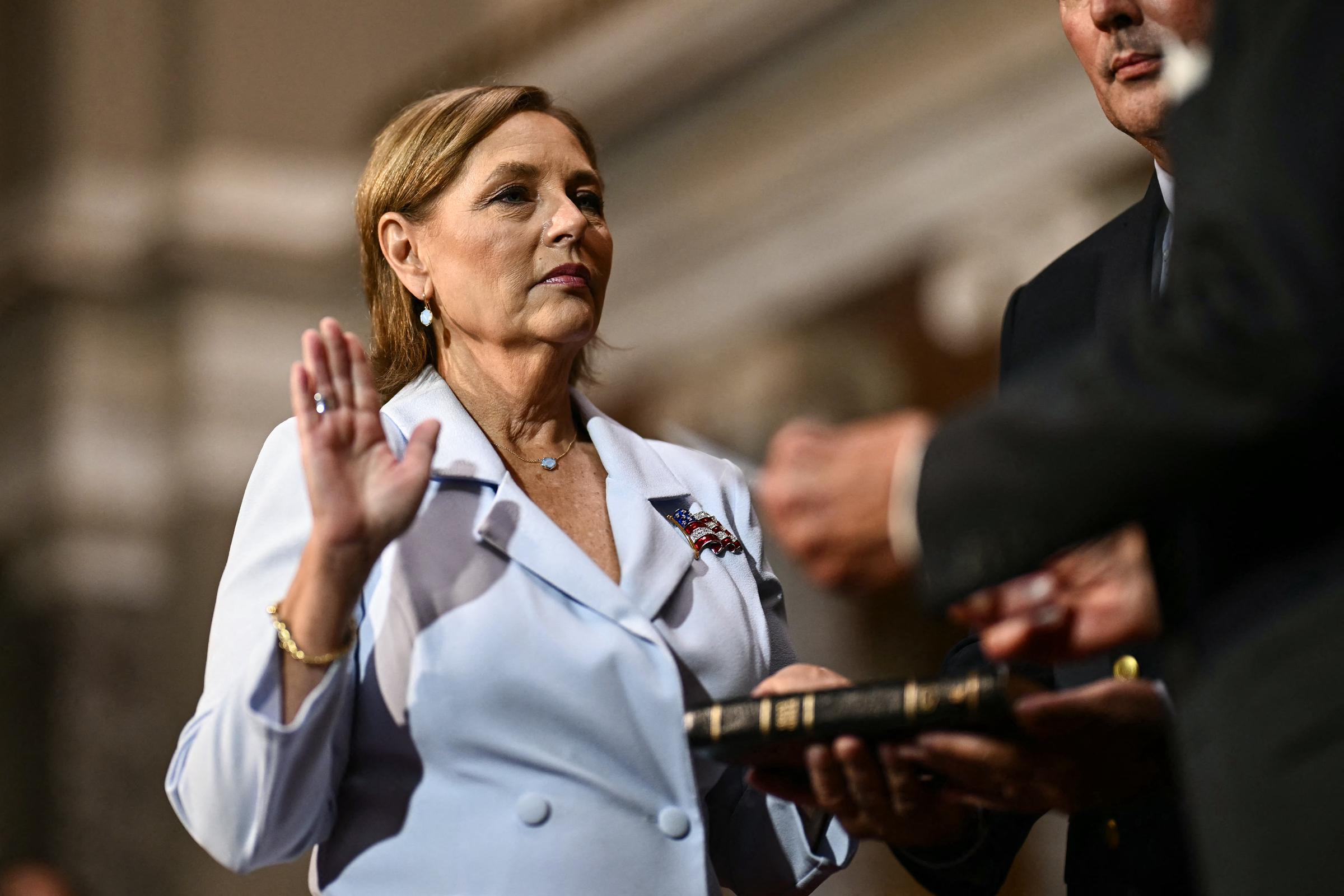 Raising her hand in a poignant Capitol Hill ceremony, Darline Graham Nordone is ceremonially sworn in as a U.S. Senator in the Old Senate Chamber on July 14, 2026, officially taking up her late brother's mantle in Washington. | Source: Getty Images