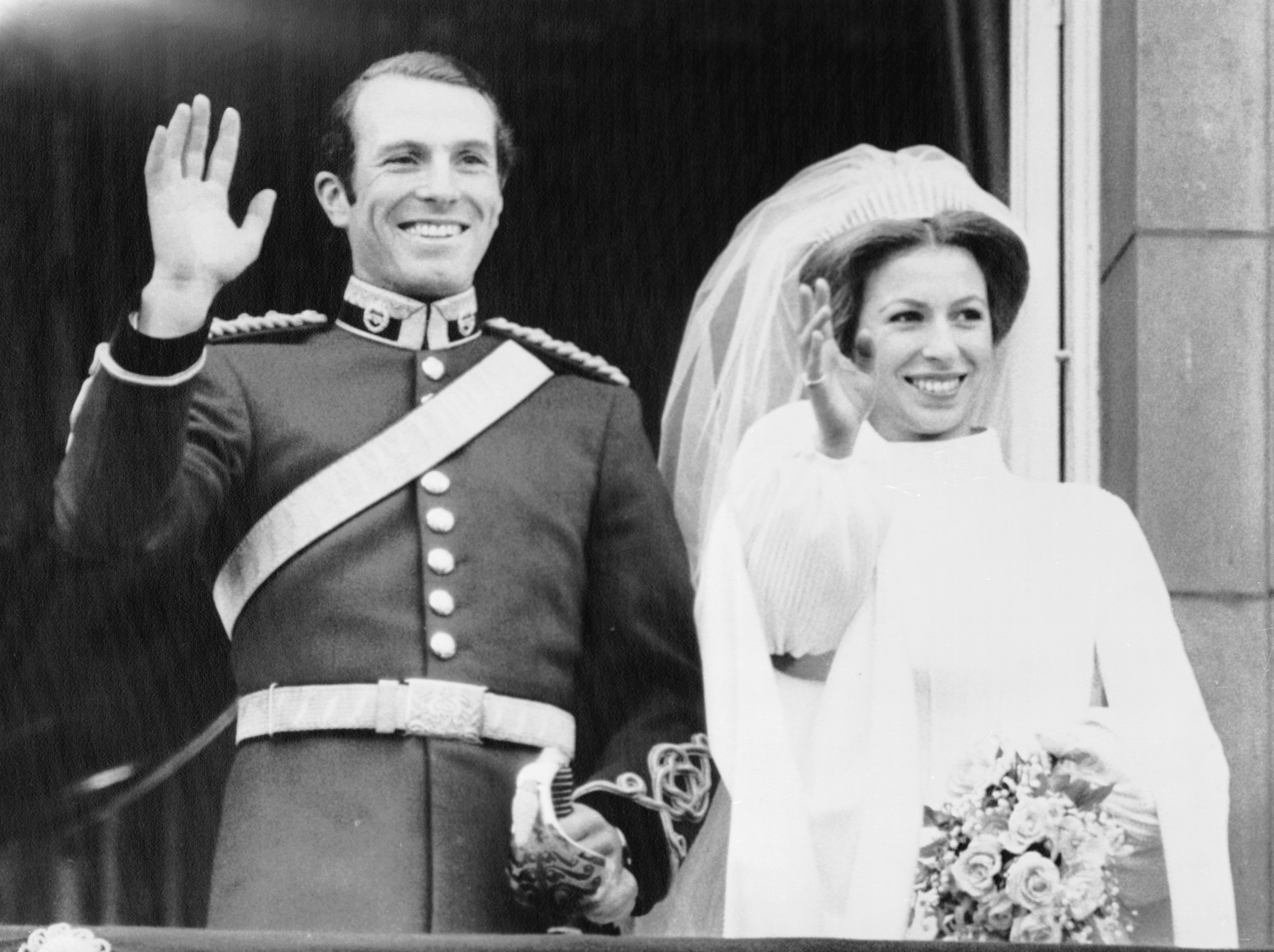 Princess Anne and Capt. Mark Phillips wave to cheering crowds from the balcony of Buckingham Palace, Nov. 14th, after their wedding at Westminster Abbey. | Source: Getty Images