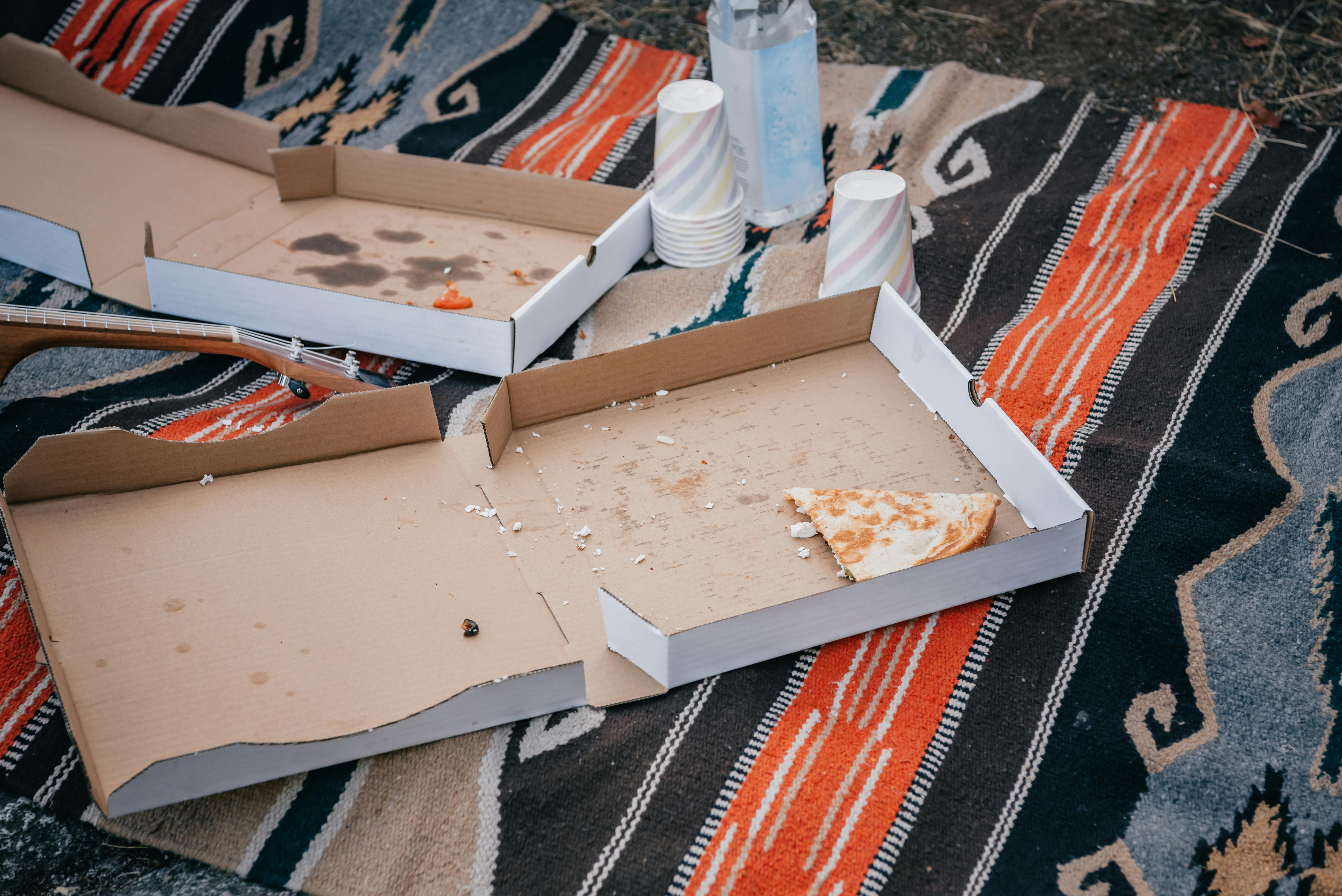 Empty pizza boxes | Source: Pexels