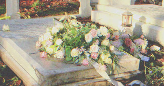 Flowers on top of a grave | Source: Shutterstock