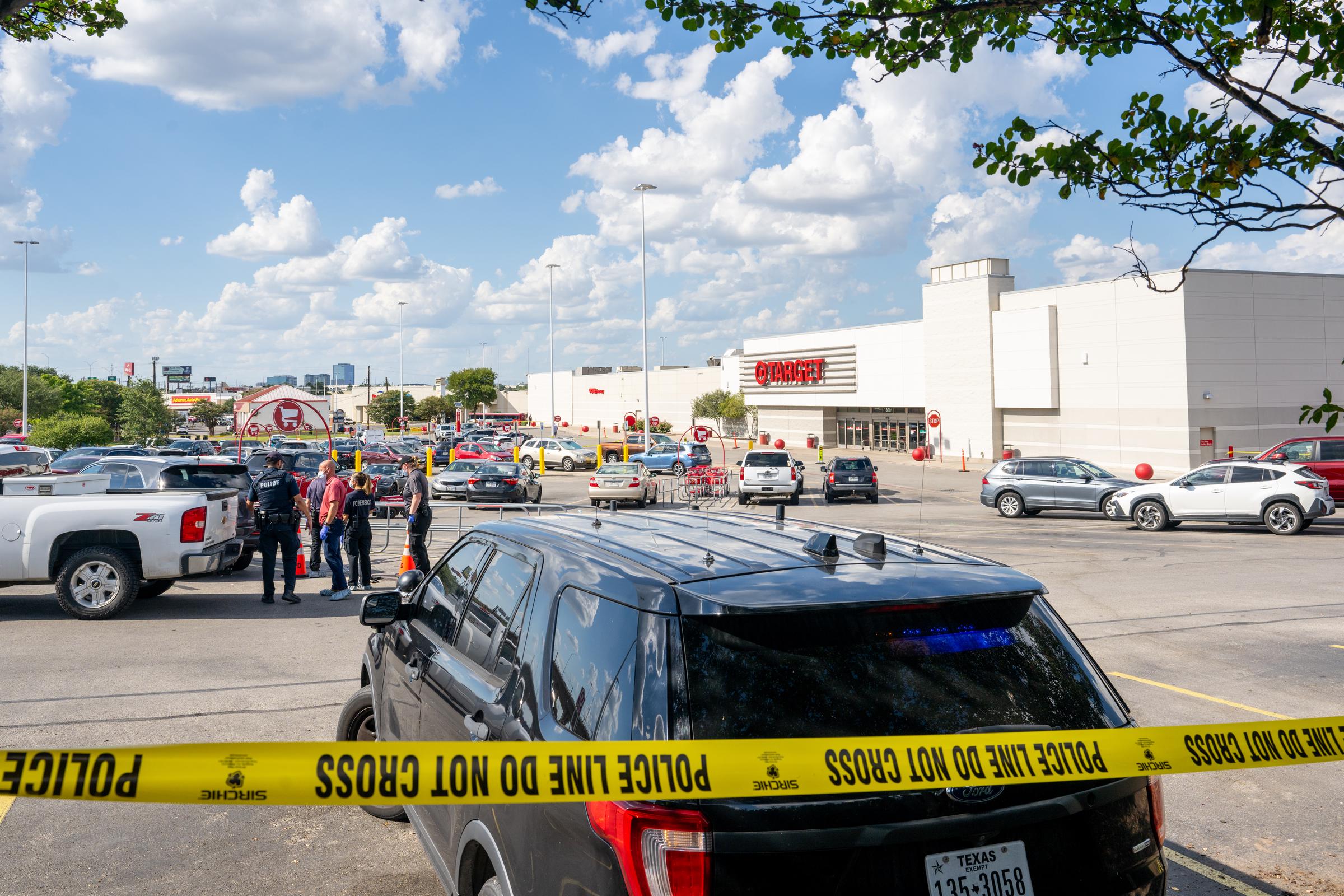Investigators gather outside the north Austin Target where a deadly shooting occurred on August 11, 2025 | Source: Getty Images