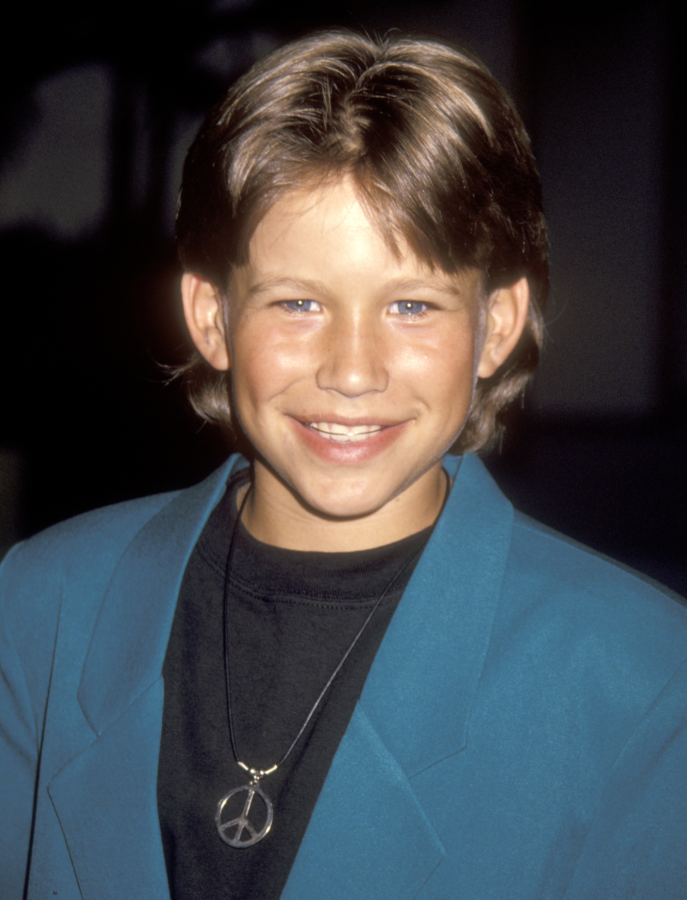 Jonathan Taylor Thomas smiles while attending the ABC Television Affiliates Party at the Century Plaza Hotel in Los Angeles, California.