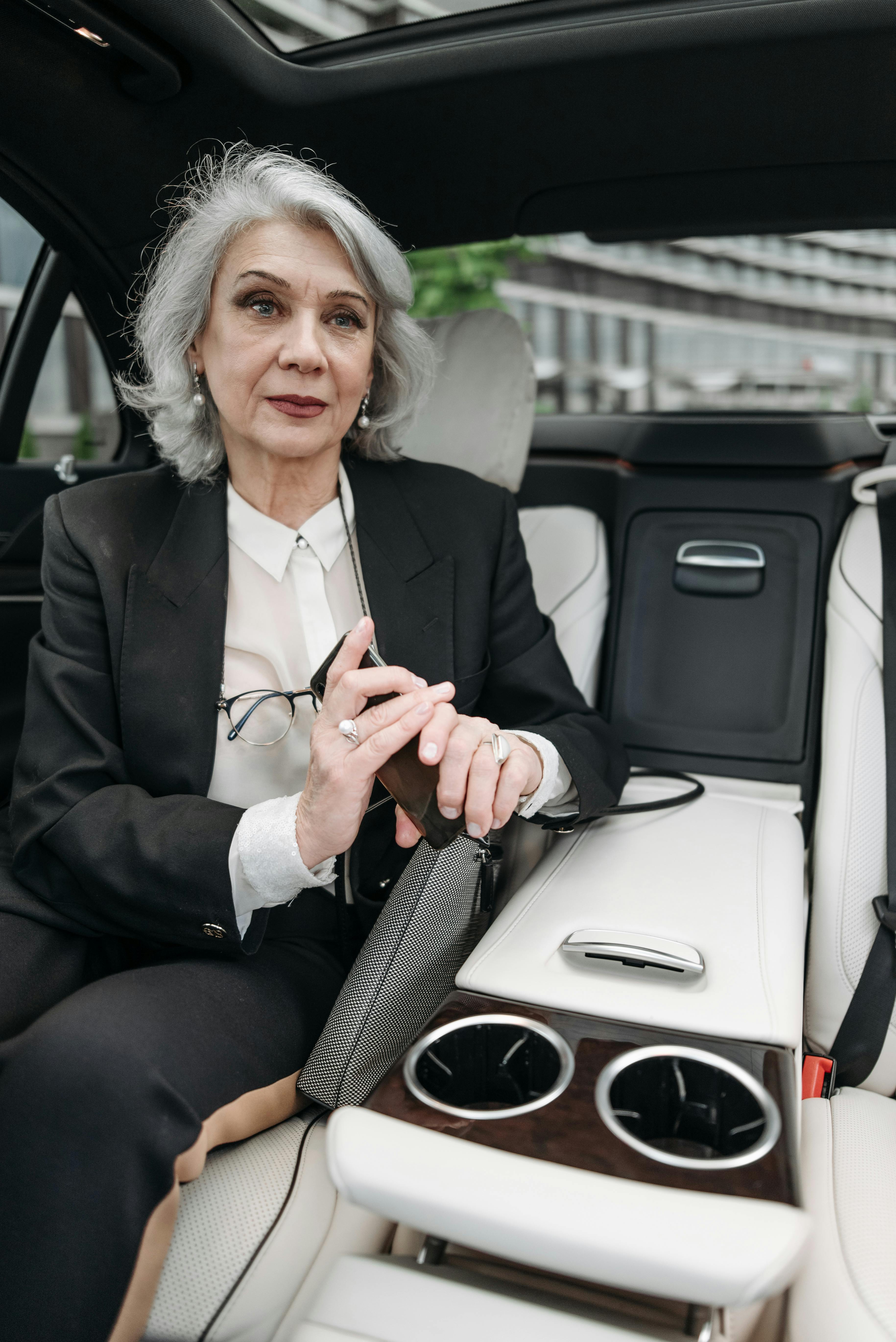 The elderly woman in the back of the car | Source: Pexels