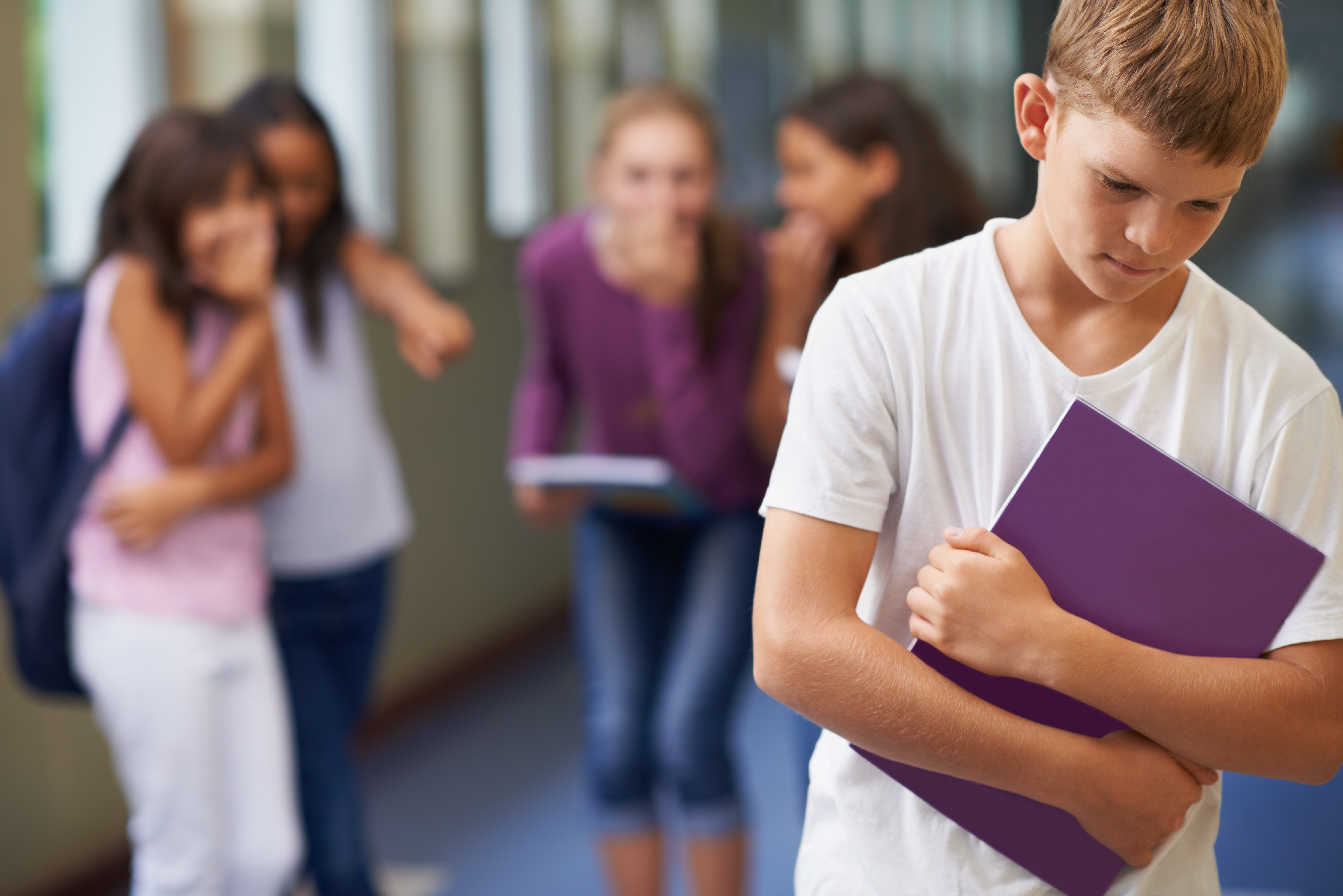 School children bullying another child at school | Source: Shutterstock
